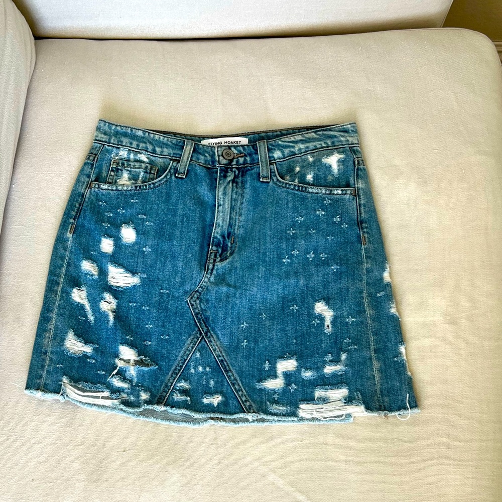 Distressed denim mini skirt